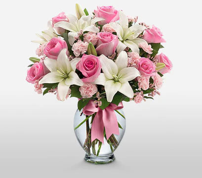 Blushing Elegance in glass vase